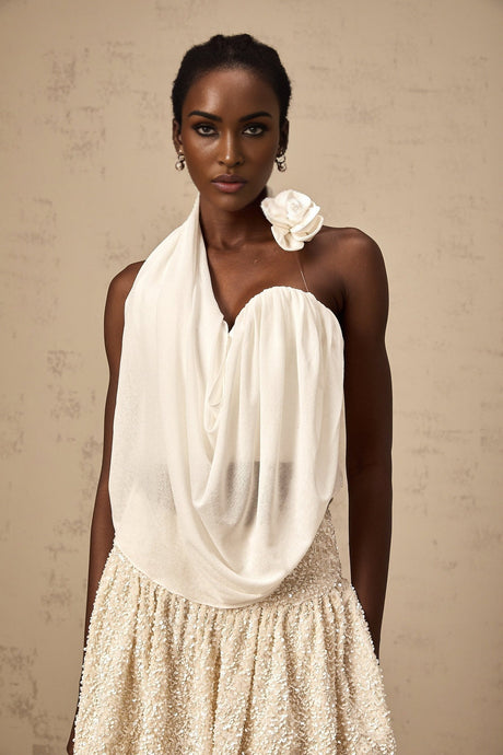 A white halterneck top with floral appliques named Maeva