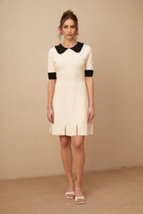 A white knitted mini dress with a split hem design named Andrea