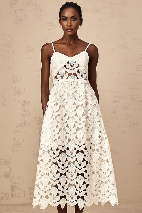 A white lace midi dress with cutout details named Delphine featuring a delicate floral pattern and an elegant silhouette