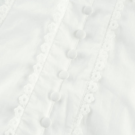 A white lace midi dress with floral embroidery details featuring a delicate pattern and feminine silhouette