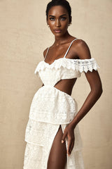 A white lace midi dress with openwork detailing and a feminine silhouette named Genevieve