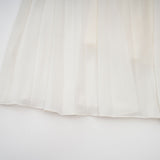 A white matching set featuring a pleated jacket and dress with embellishments The jacket has long sleeves and the dress has a fitted silhouette Both pieces are adorned with delicate embroidery or beadwork creating an elegant ensemble