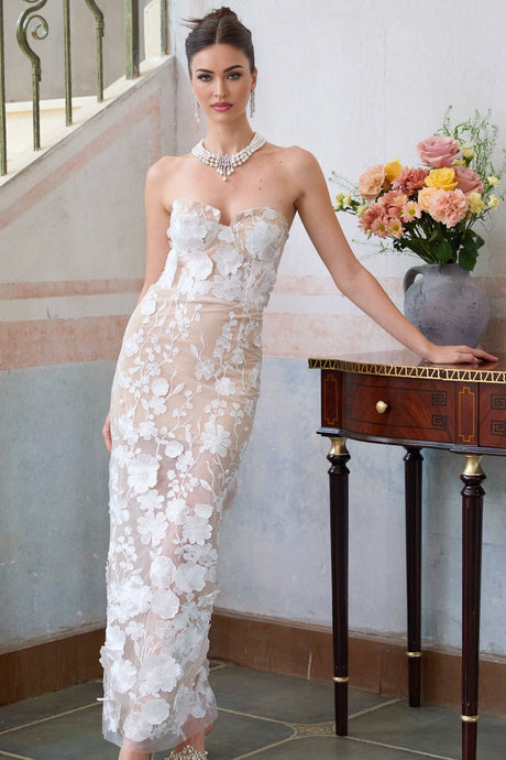 A white maxi dress with floral applique details and a corsetstyle bodice named Brigitte