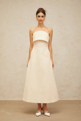 A white midi dress with a folded corset bodice and a fitted silhouette named Raphaelle