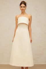 A white midi dress with a folded corset bodice and slim silhouette featuring a design by Raphaelle