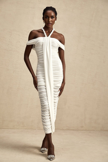A white midi dress with braided rope detailing named Émeline