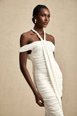 A white midi dress with braided rope detailing named Émeline