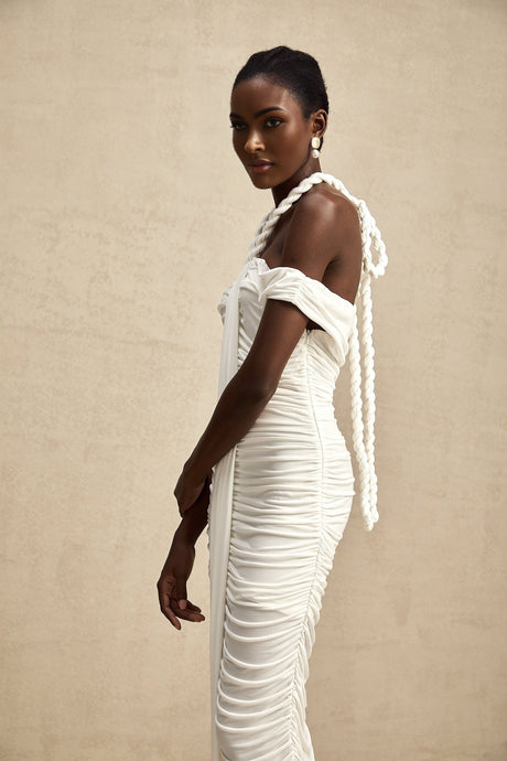 A white midi dress with braided rope detailing named Emeline