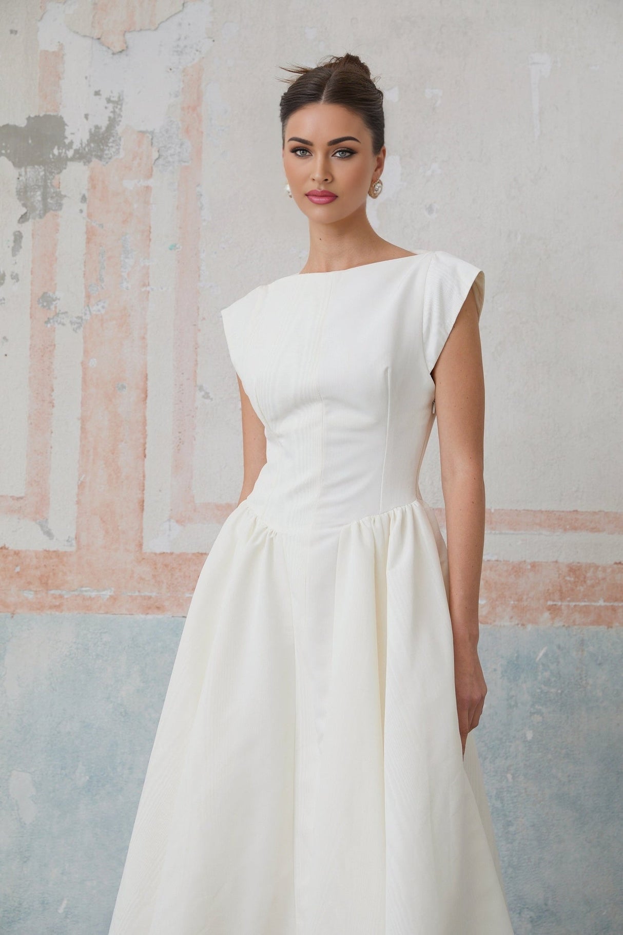 A white midi dress with cap sleeves and an open back named Amandine