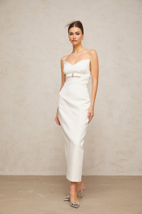 A white midi dress with corsetstyle bodice and bow detail featuring a fitted silhouette and elegant design