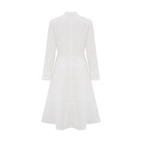 A white midi dress with panelled design and embroidery details named Madeleine featuring a feminine silhouette and delicate stitching throughout