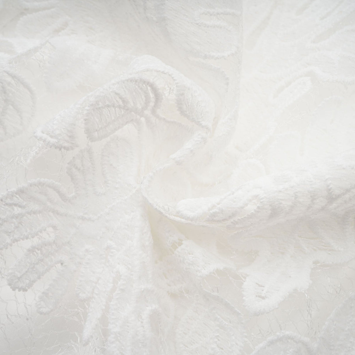 A white midi dress with panelled design and embroidery details named Madeleine featuring a fitted bodice and flared skirt