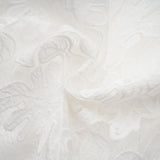 A white midi dress with panelled design and embroidery details named Madeleine featuring a fitted bodice and flared skirt