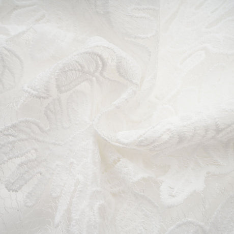 A white midi dress with panelled design and embroidery details named Madeleine featuring a fitted bodice and flared skirt