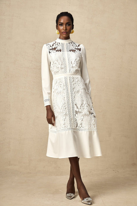 A white midi dress with panelled design and embroidery details named Madeleine featuring a fitted silhouette and delicate feminine style