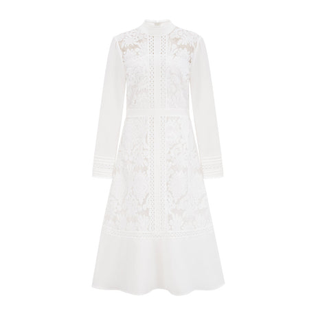 A white midi dress with panelled design and embroidery details named Madeleine featuring a fitted silhouette and delicate floral patterns