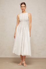 A white midi dress with pointelle detailing and puff sleeves named Helene
