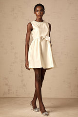 A white mini dress with a bowknot embellishment named Isabelle