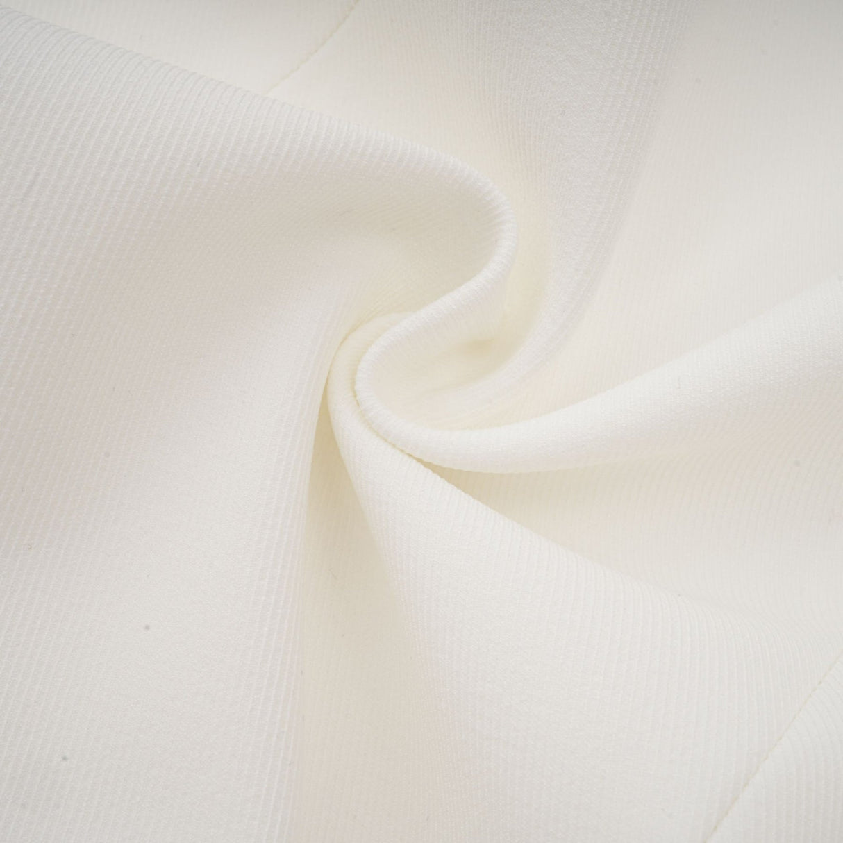 A white mini dress with a bubble skirt and fitted bodice named Elodie