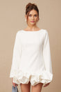 A white mini dress with a bubble skirt and short sleeves featuring a fitted bodice and flared bottom