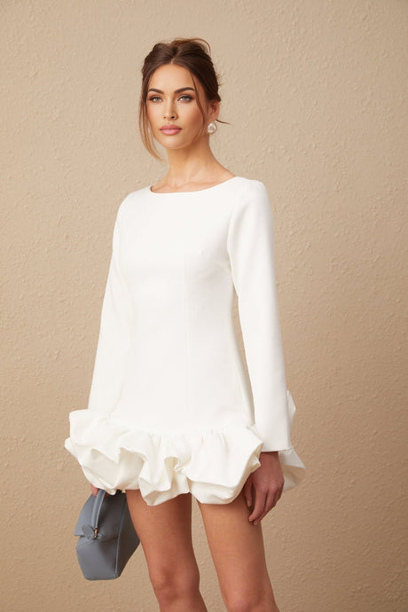 A white mini dress with a bubble skirt and short sleeves featuring a fitted bodice and flared bottom