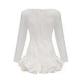 A white mini dress with a bubble skirt featuring a fitted bodice and short puffed sleeves