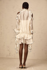 A white mini dress with a flounced skirt and ribbon details named Tiphaine