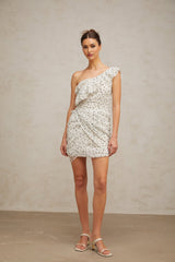 A white mini dress with a printed pattern and ruffled details named Irina