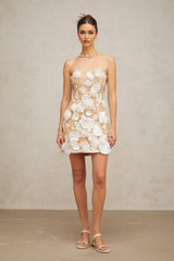 A white mini dress with floral applique details featuring a delicate Veronica flower design