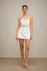 A white mini dress with floral applique details named Lucie