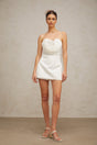 A white mini dress with floral applique details named Lucie