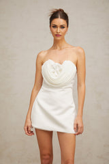 A white mini dress with floral applique details named Lucie