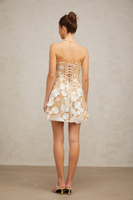A white mini dress with floral appliques featuring a delicate Veronica flower design