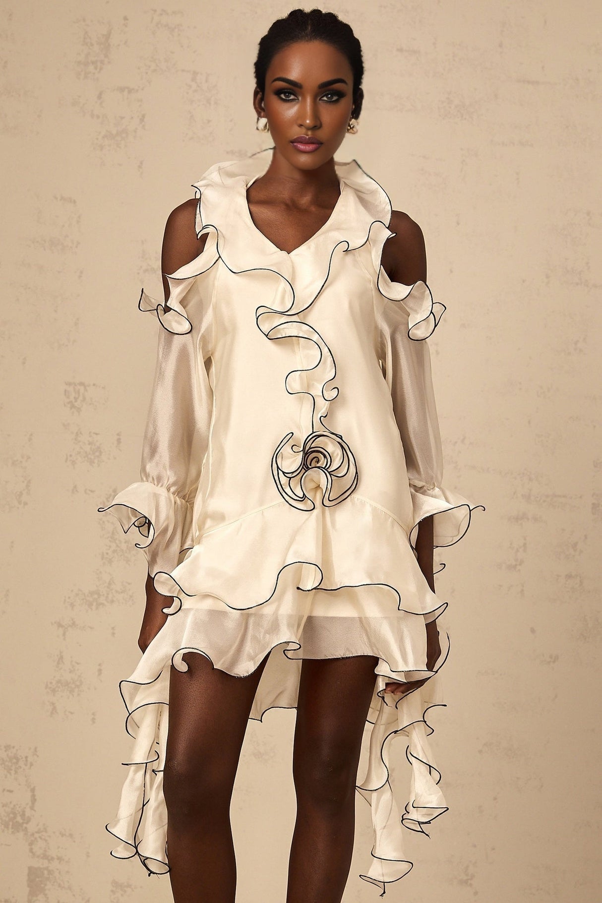 A white mini dress with flounce detailing and ribbon accents named Tiphaine