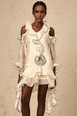 A white mini dress with flounce detailing and ribbon accents named Tiphaine