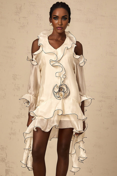 A white mini dress with flounce detailing and ribbon accents named Tiphaine