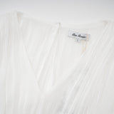 A white mini dress with full pleats and a cinched waist featuring a rosier design
