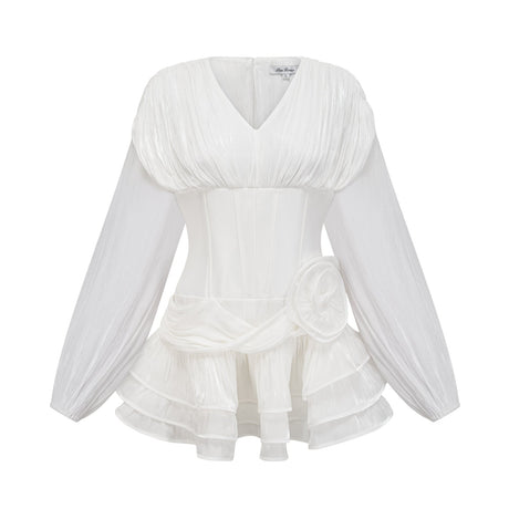 A white mini dress with full pleats and a cinched waist featuring a rosier style design