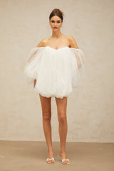 A white mini dress with layered bubble tulle skirt and sleeves named Avril