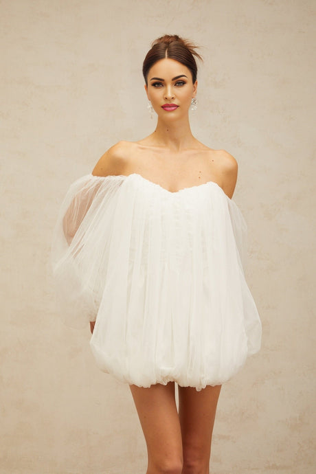 A white mini dress with layered bubble tulle skirt and sleeves named Avril