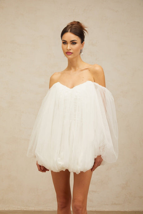 A white mini dress with layered bubble tulle skirt featuring a fitted bodice and short length named Avril