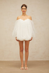 A white mini dress with layered bubble tulle skirt named Avril featuring a short length and voluminous texture