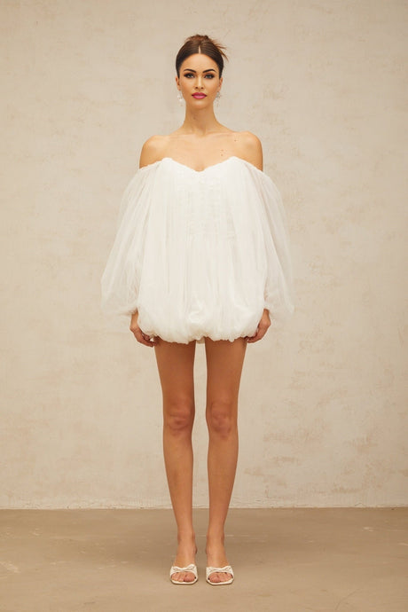 A white mini dress with layered bubble tulle skirt named Avril featuring a short length and voluminous texture