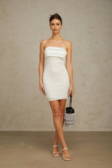 A white mini dress with offshoulder design and sequin embellishments