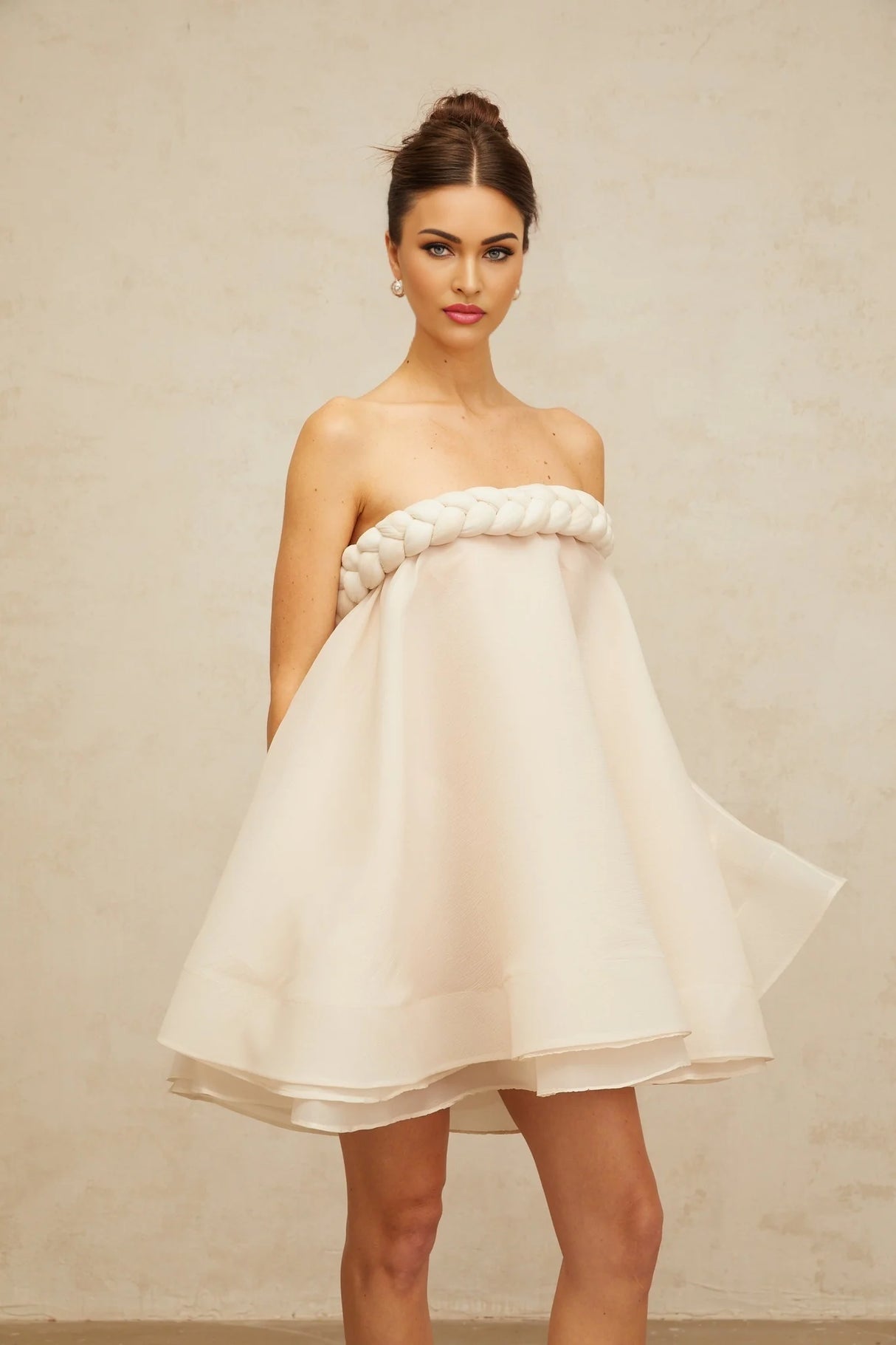A white mini dress with puff sleeves and braided details named Violette