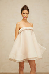 A white mini dress with puff sleeves and braided details named Violette