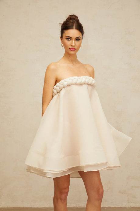 A white mini dress with puff sleeves and braided details named Violette