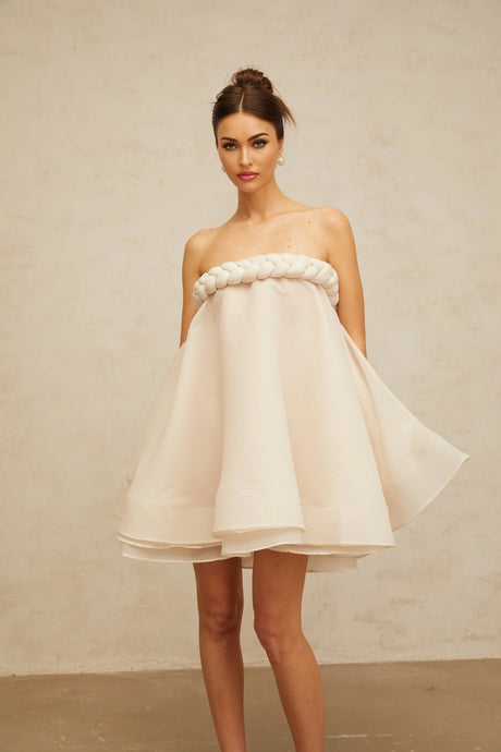 A white mini dress with puff sleeves and braided details named Violette