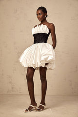 A white mini dress with puffed sleeves featuring lace paneling and a satin finish named Éliane