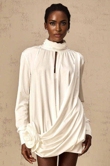 A white mini dress with ruched detailing and faux flower embellishments featuring a fitted silhouette and short length